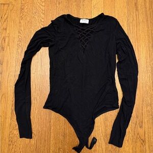 Black body suit with criss cross detail